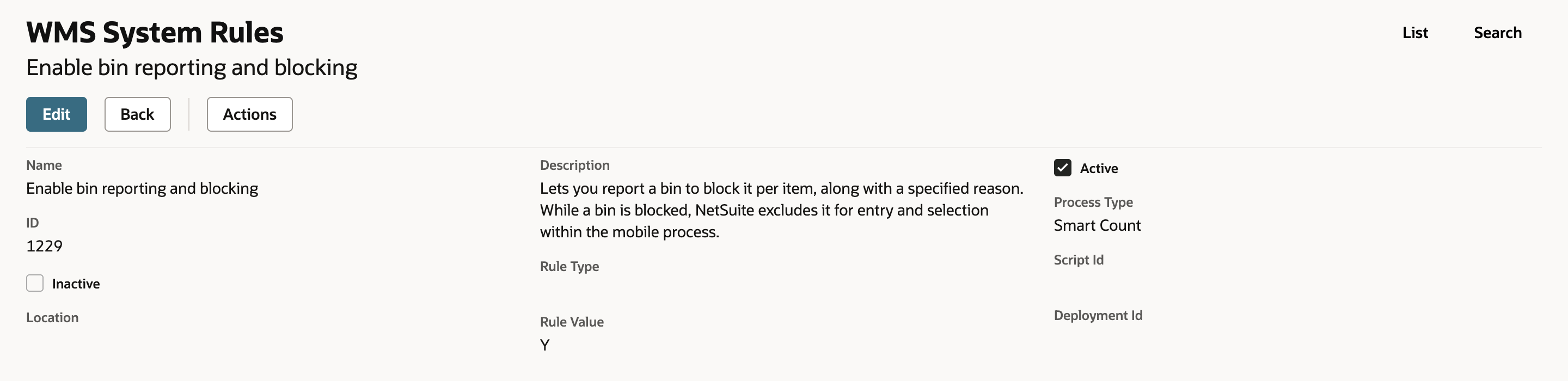 The WMS System Rules record Enable bin reporting and blocking with Active selected, rule value Y and its description.