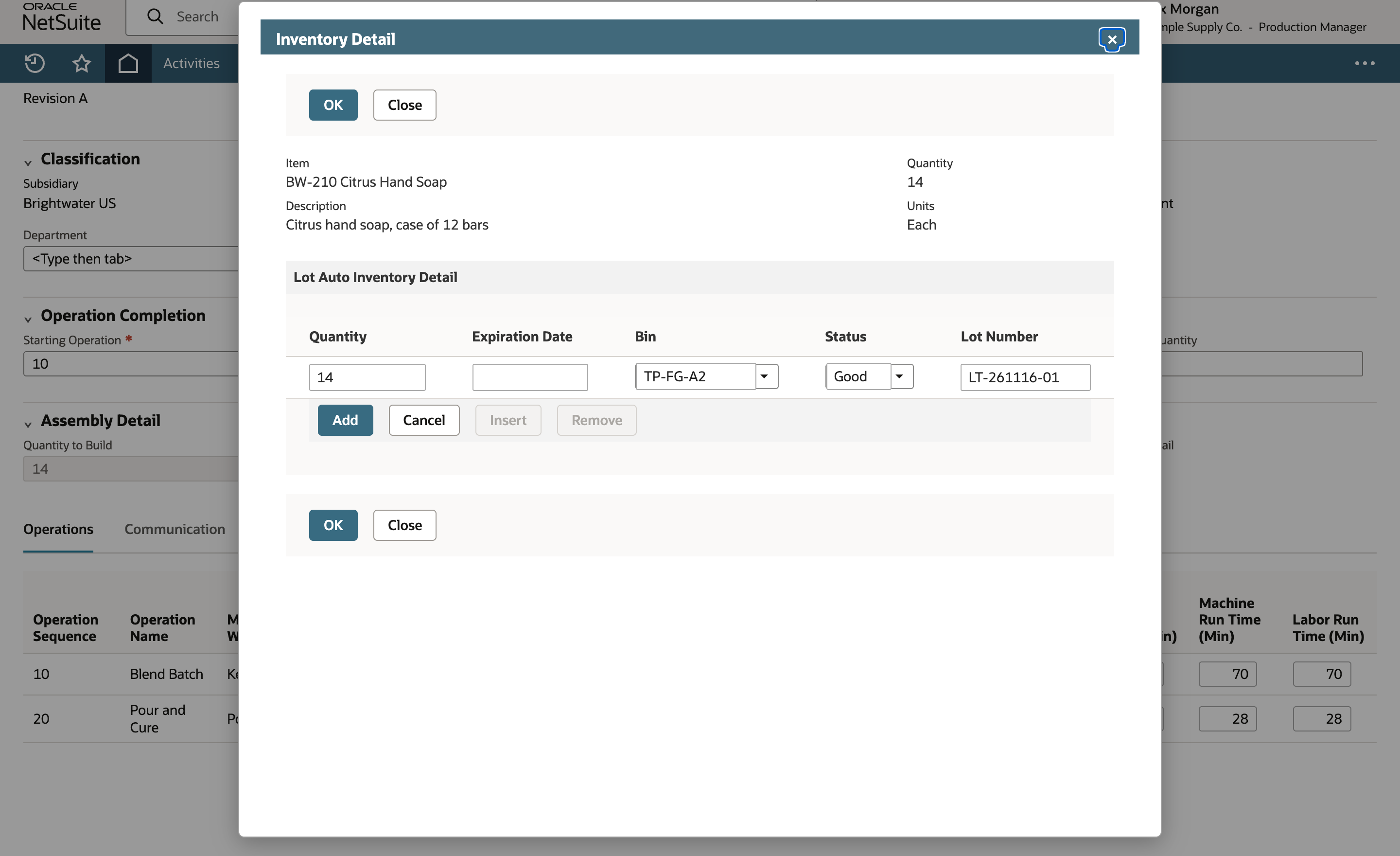 NetSuite Inventory Detail dialog with quantity 14, bin TP-FG-A2, status Good and lot number LT-261116-01 typed in the entry row