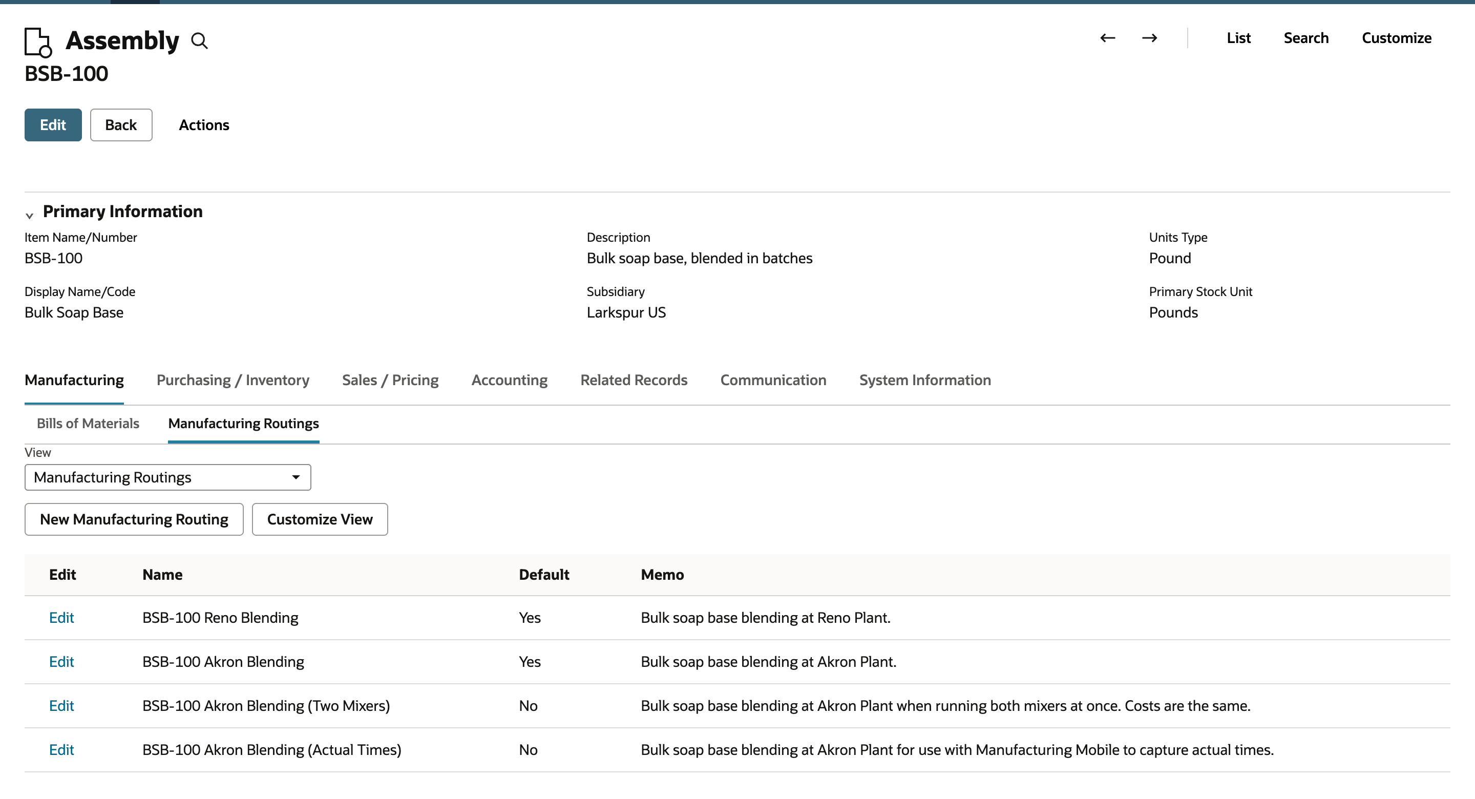 NetSuite assembly item BSB-100 on the Manufacturing Routings inner tab listing four routings with Default Yes for Reno Blending and Akron Blending